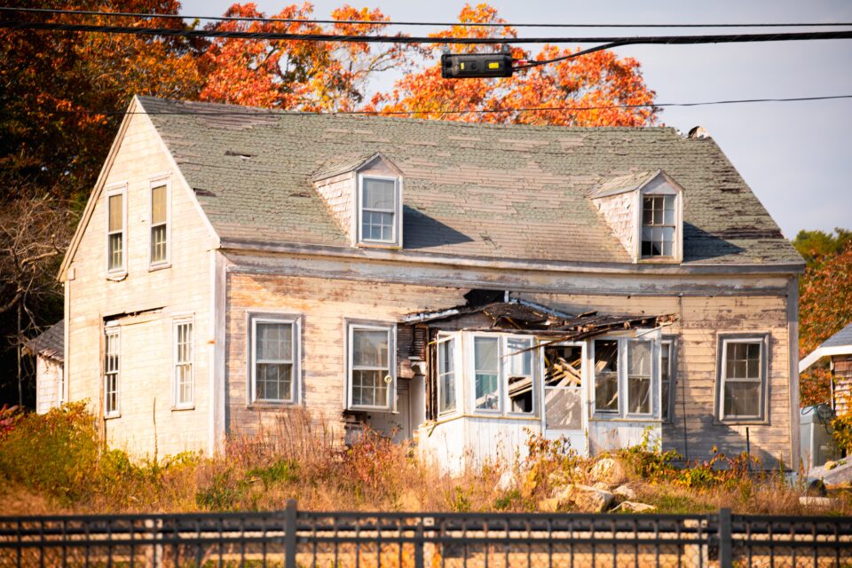 Condemned house with official notice posted in Virginia neighborhood